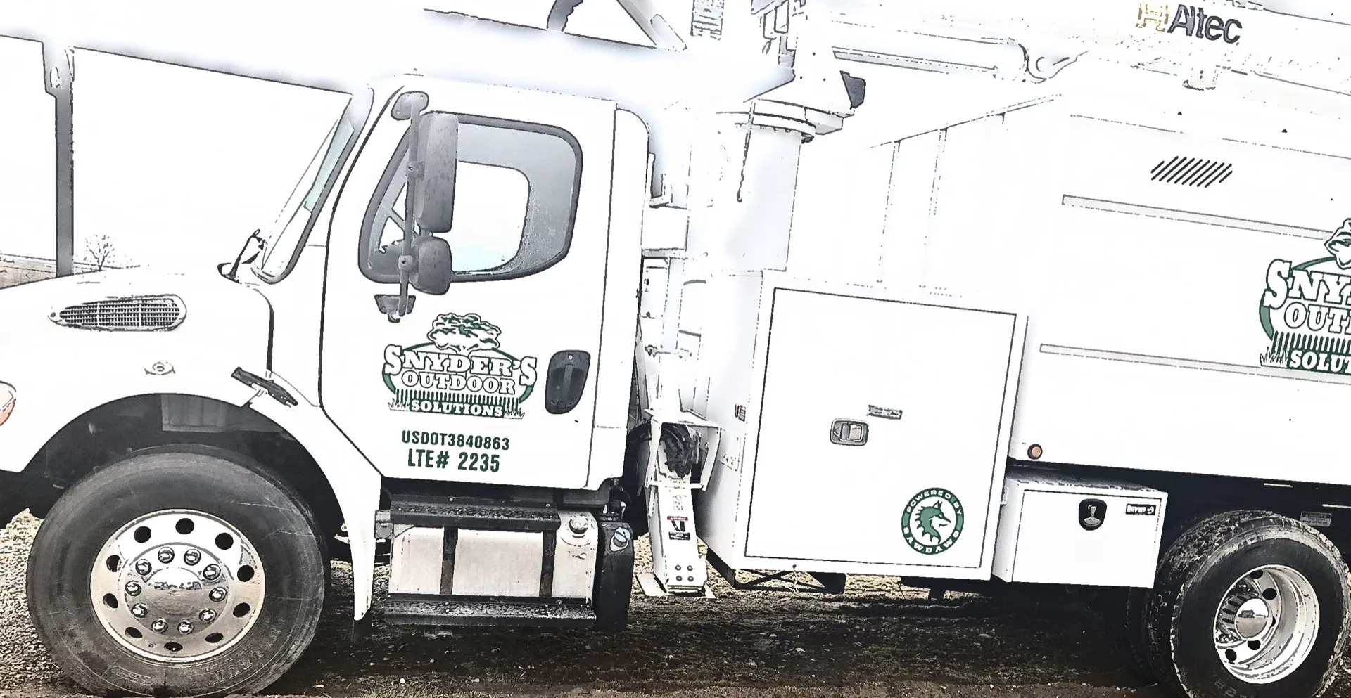Snyder's Outdoor Solutions branded bucket truck.